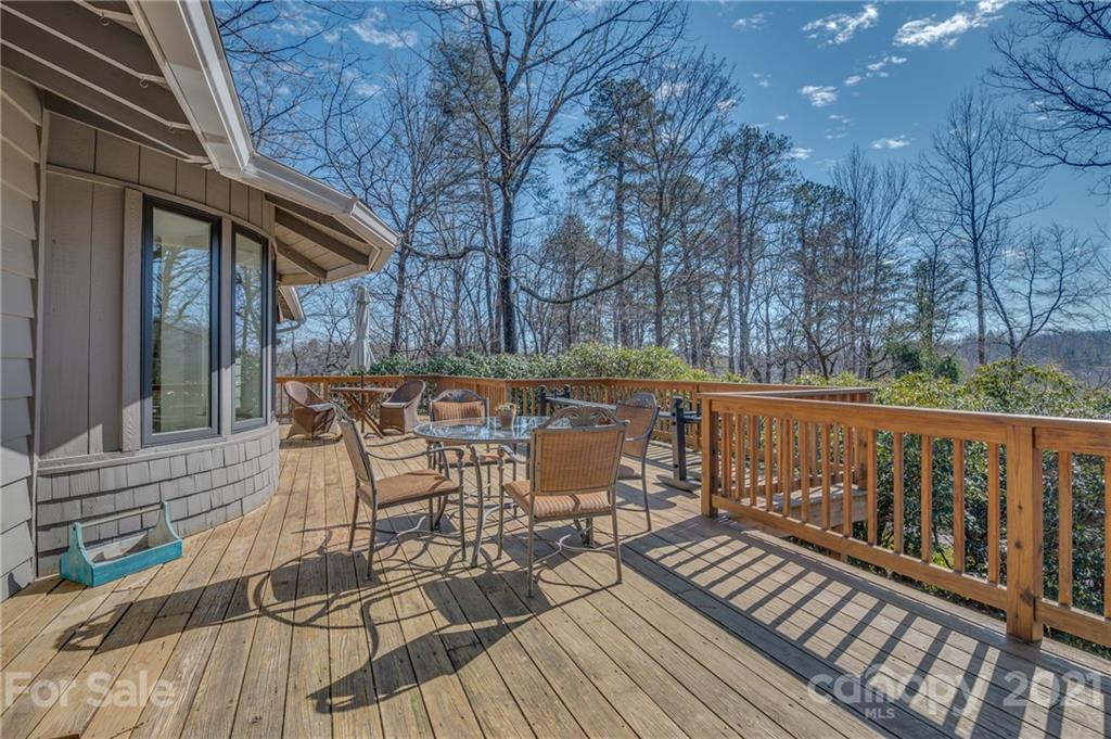 172 Wilderness Road Tryon, NC 28782 - Photo 19 of 46 a view of a chairs on wooden deck