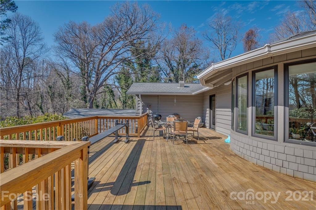 172 Wilderness Road Tryon, NC 28782 - Photo 22 of 46 a view of balcony with deck and outdoor seating