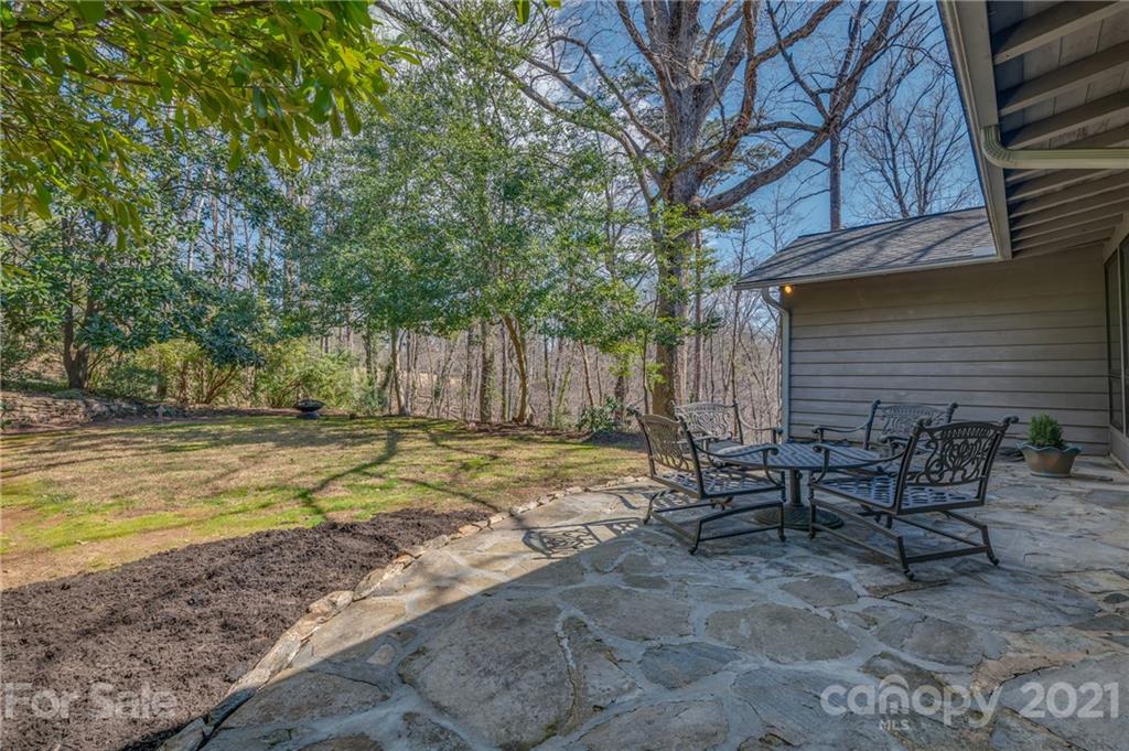 172 Wilderness Road Tryon, NC 28782 - Photo 23 of 46 a view of a house with backyard and chairs