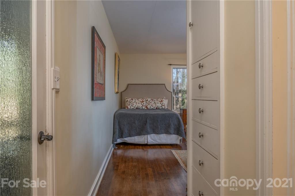 172 Wilderness Road Tryon, NC 28782 - Photo 26 of 46 a bedroom with a bed and a cabinets