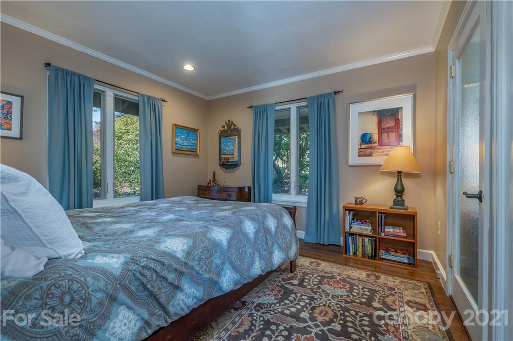 172 Wilderness Road Tryon, NC 28782 - Photo 33 of 46 a bedroom with a bed and a table in it