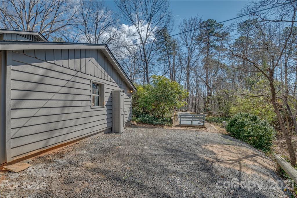 172 Wilderness Road Tryon, NC 28782 - Photo 40 of 46 a view of a house with a yard