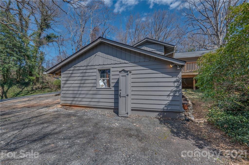 172 Wilderness Road Tryon, NC 28782 - Photo 41 of 46 a view of a house with a yard