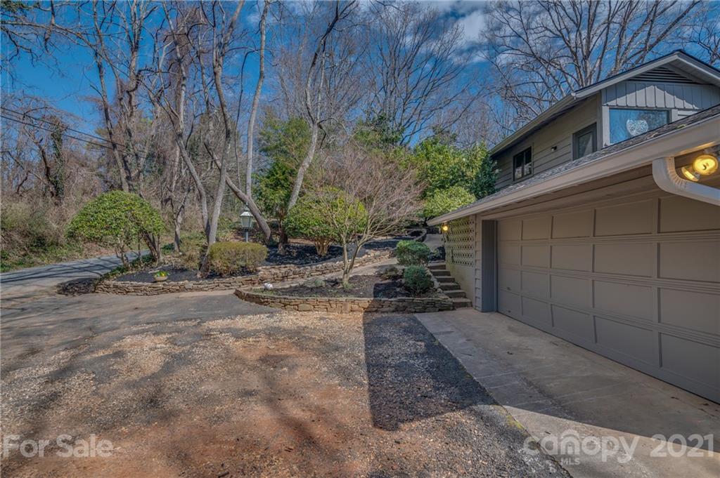 172 Wilderness Road Tryon, NC 28782 - Photo 42 of 46 a view of a house with a yard