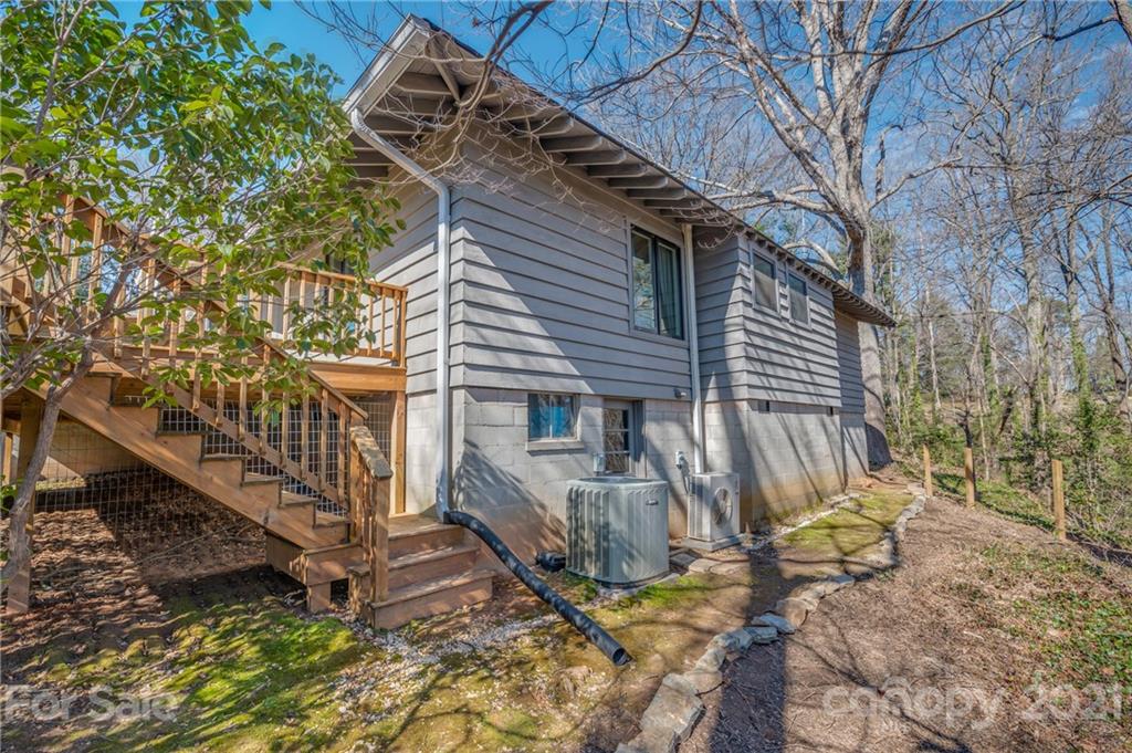 172 Wilderness Road Tryon, NC 28782 - Photo 44 of 46 a view of a house with backyard and wooden fence
