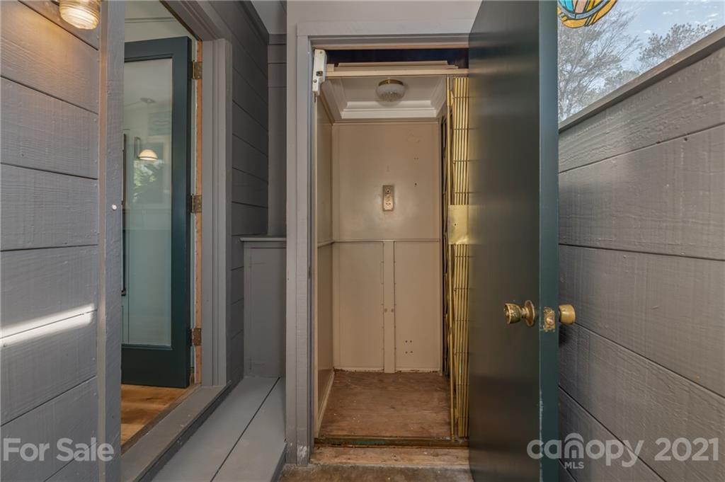 172 Wilderness Road Tryon, NC 28782 - Photo 45 of 46 a bathroom with a glass shower door