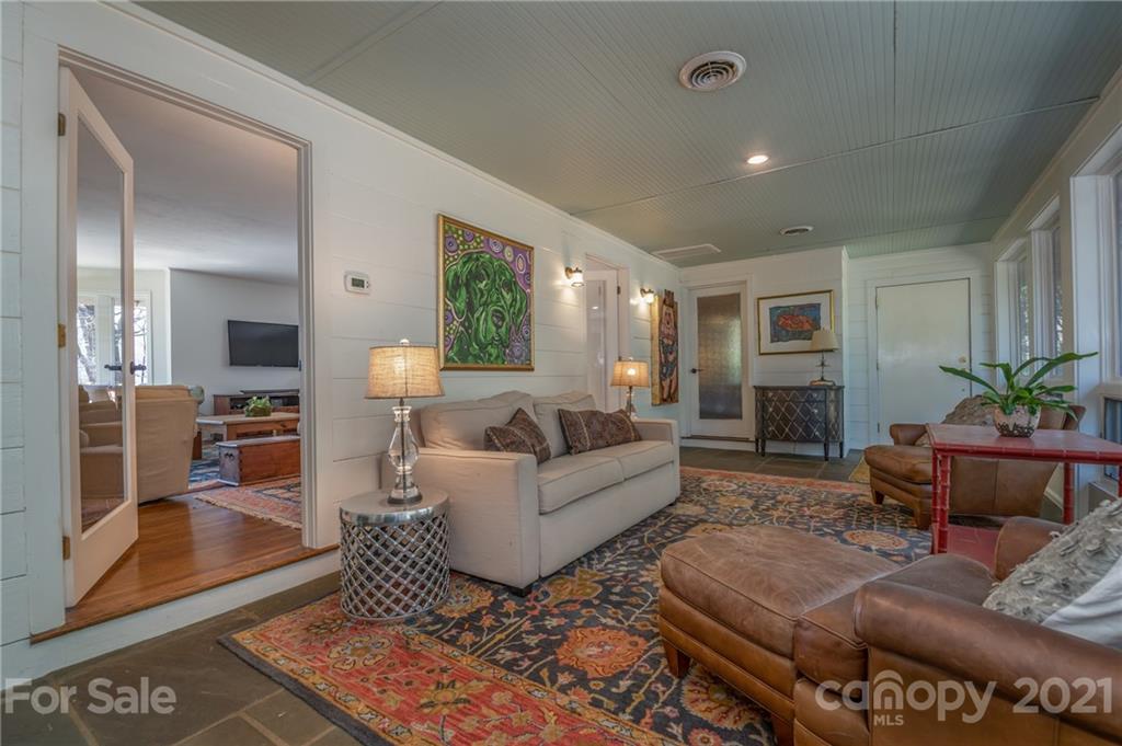 172 Wilderness Road Tryon, NC 28782 - Photo 8 of 46 a living room with furniture and wooden floor