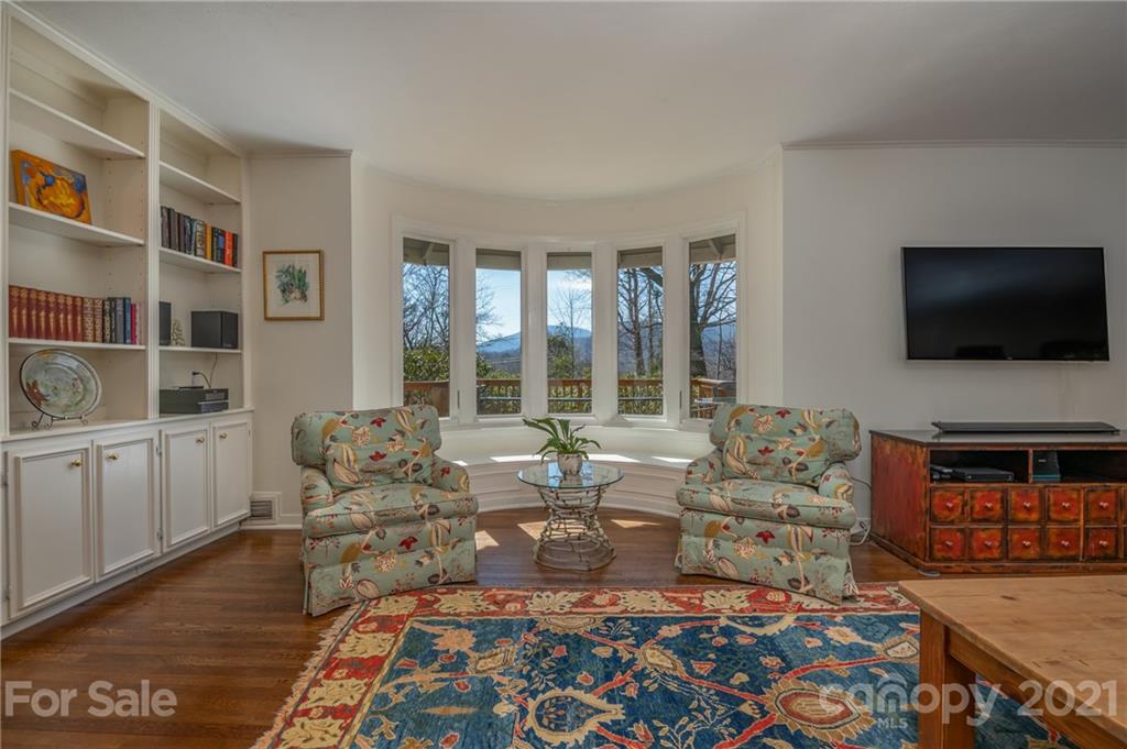 172 Wilderness Road Tryon, NC 28782 - Photo 9 of 46 a living room with furniture and a flat screen tv