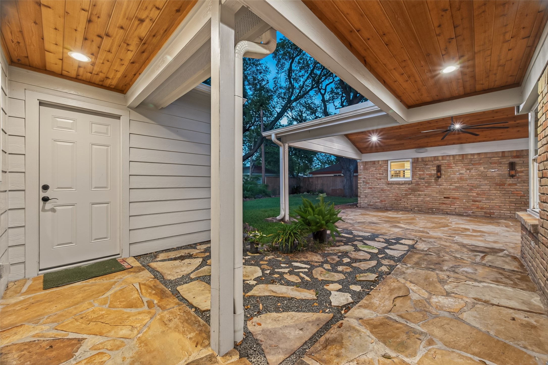5638 Sanford Road Houston, TX 77096 - Photo 4 of 41 Beautiful outdoor retreat showcasing a cedar plank ceiling and flagstone flooring. An ideal setting for relaxing or entertaining guests.