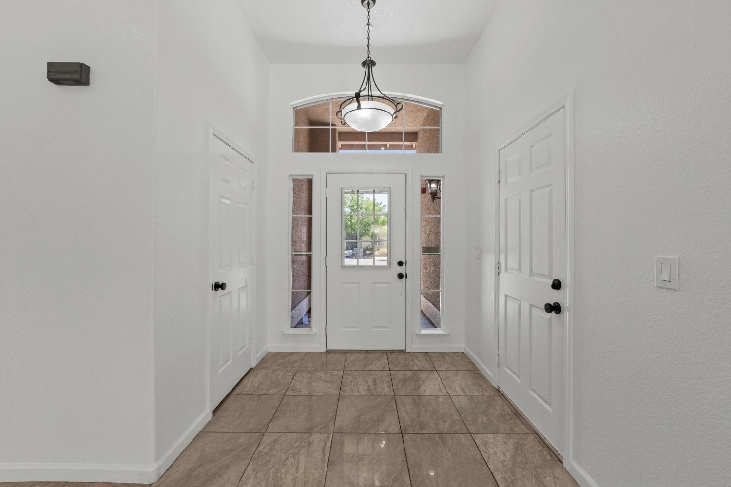 a view of an entryway with wooden floor