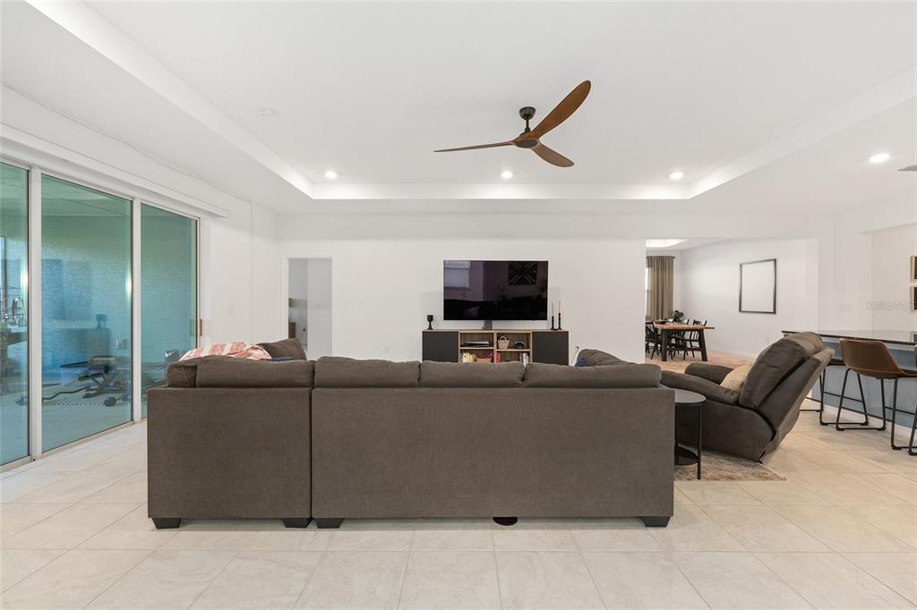 7431 Southwest 65th Place Road Ocala, FL 34474 - Photo 13 of 49 a living room with furniture and a flat screen tv