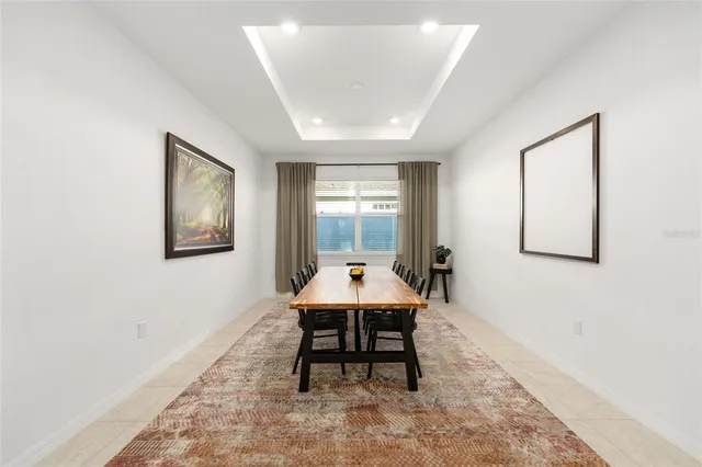 a workspace room with furniture and windows