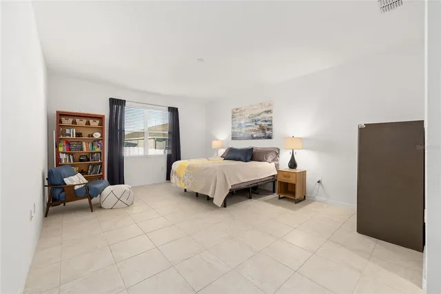 a bedroom with a bed and a cabinets