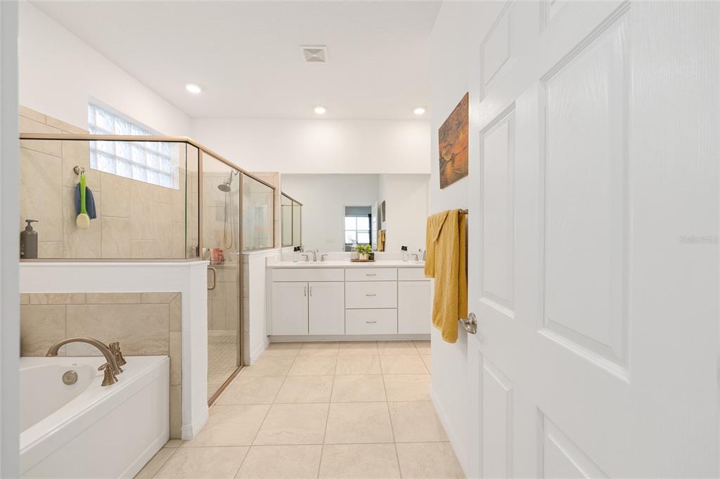 7431 Southwest 65th Place Road Ocala, FL 34474 - Photo 23 of 49 a bathroom with a tub sink and mirror