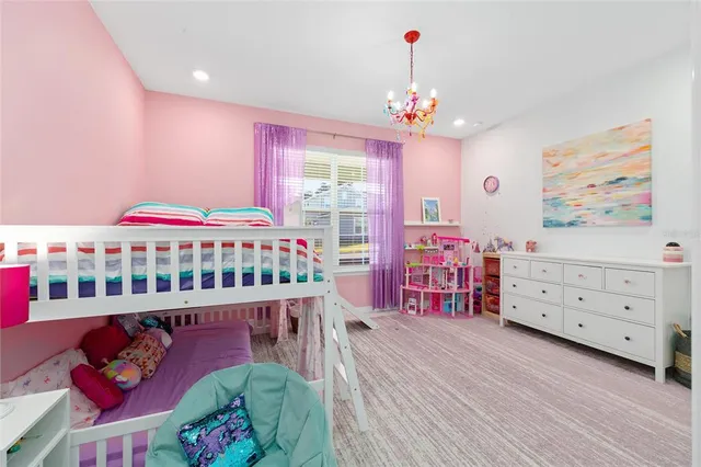 a bedroom with furniture and a baby crib