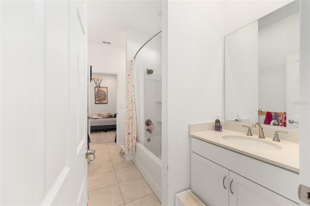 7431 Southwest 65th Place Road Ocala, FL 34474 - Photo 28 of 49 a bathroom with a sink and a mirror