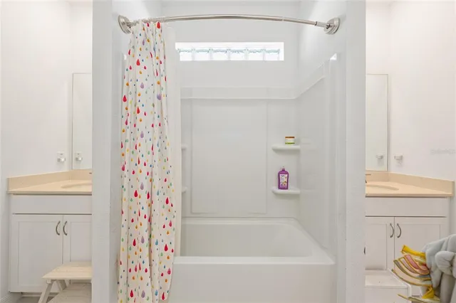 a bathroom with a bathtub and shower
