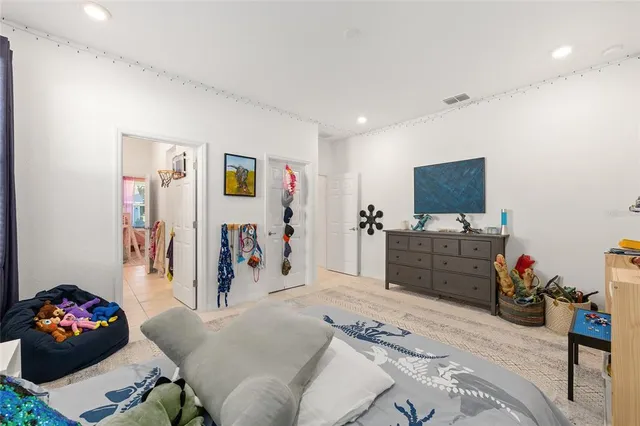 a livingroom with furniture and a flat screen tv