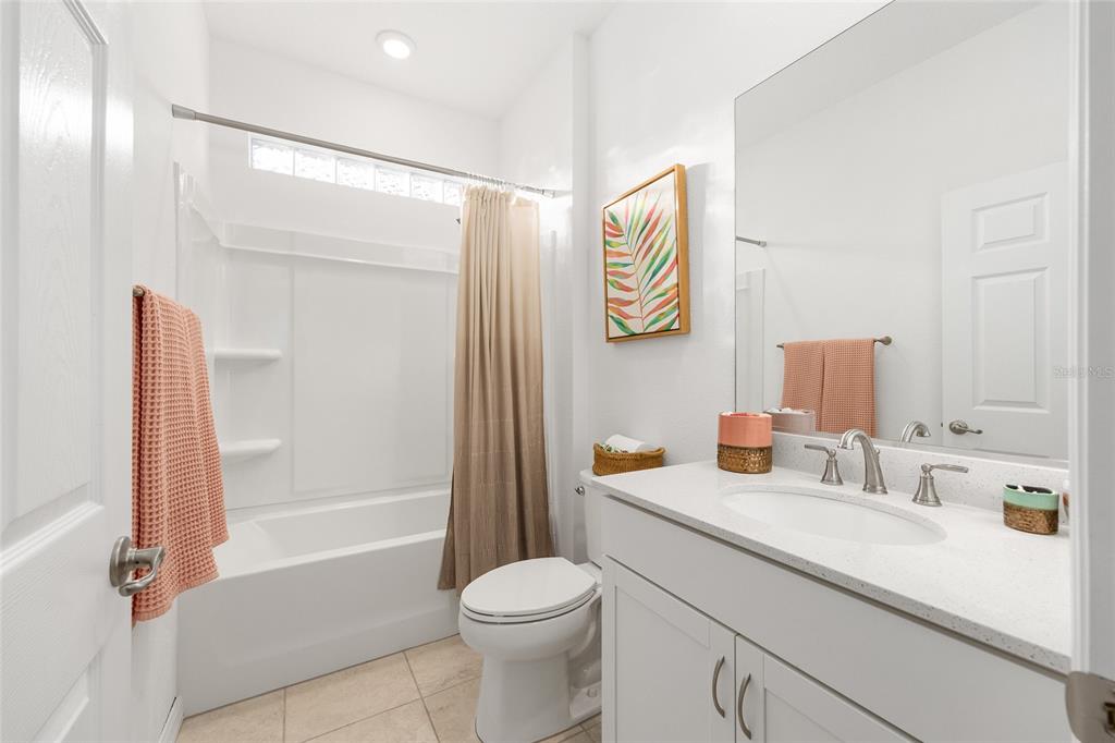 7431 Southwest 65th Place Road Ocala, FL 34474 - Photo 35 of 49 a bathroom with a sink a toilet and shower