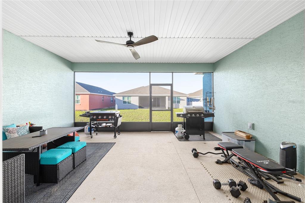 7431 Southwest 65th Place Road Ocala, FL 34474 - Photo 38 of 49 a living room with furniture gym equipment and a window