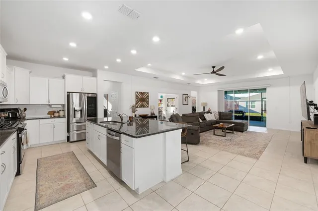 a kitchen with lots of counter top space and appliances
