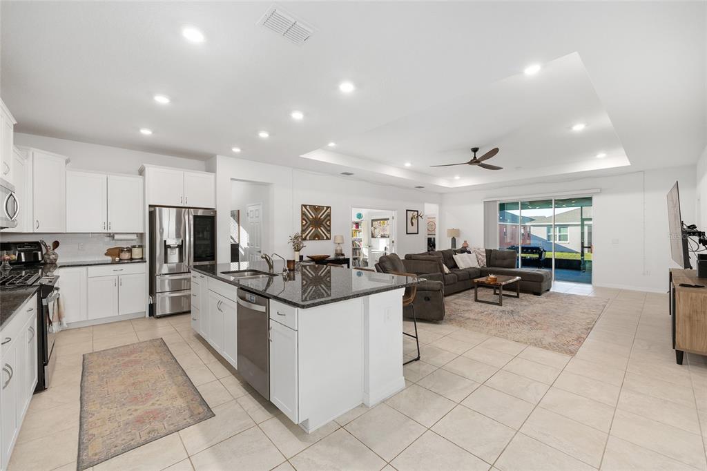 7431 Southwest 65th Place Road Ocala, FL 34474 - Photo 5 of 49 a kitchen with lots of counter top space and appliances