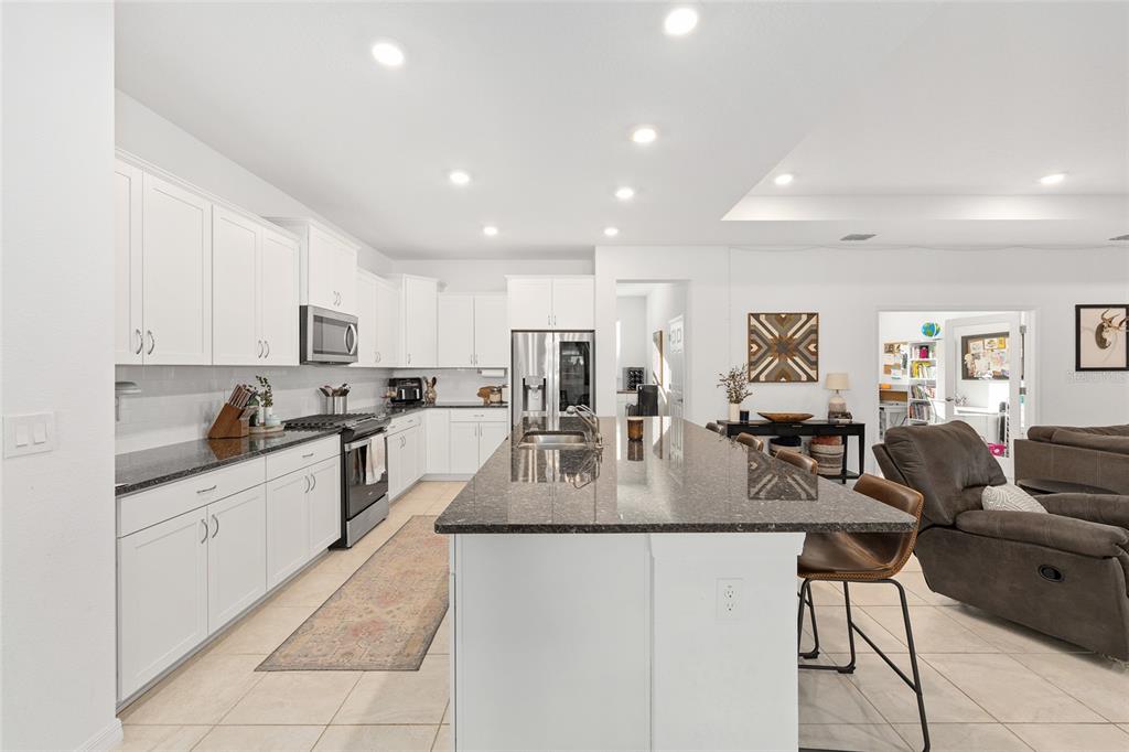 7431 Southwest 65th Place Road Ocala, FL 34474 - Photo 9 of 49 a large kitchen with stainless steel appliances lots of counter top space