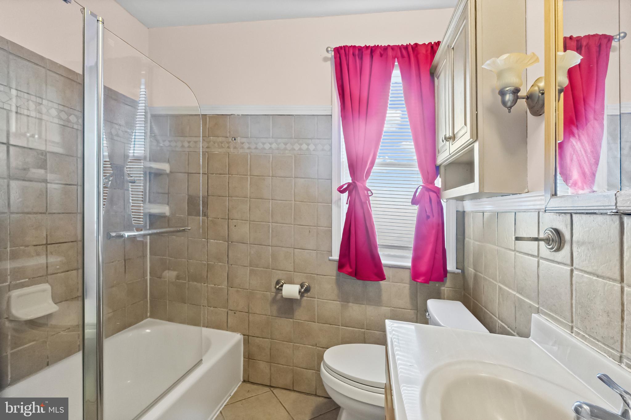 1205 Sheridan Avenue Baltimore, MD 21239 - Photo 13 of 22 Bright and inviting bathroom with modern touches.