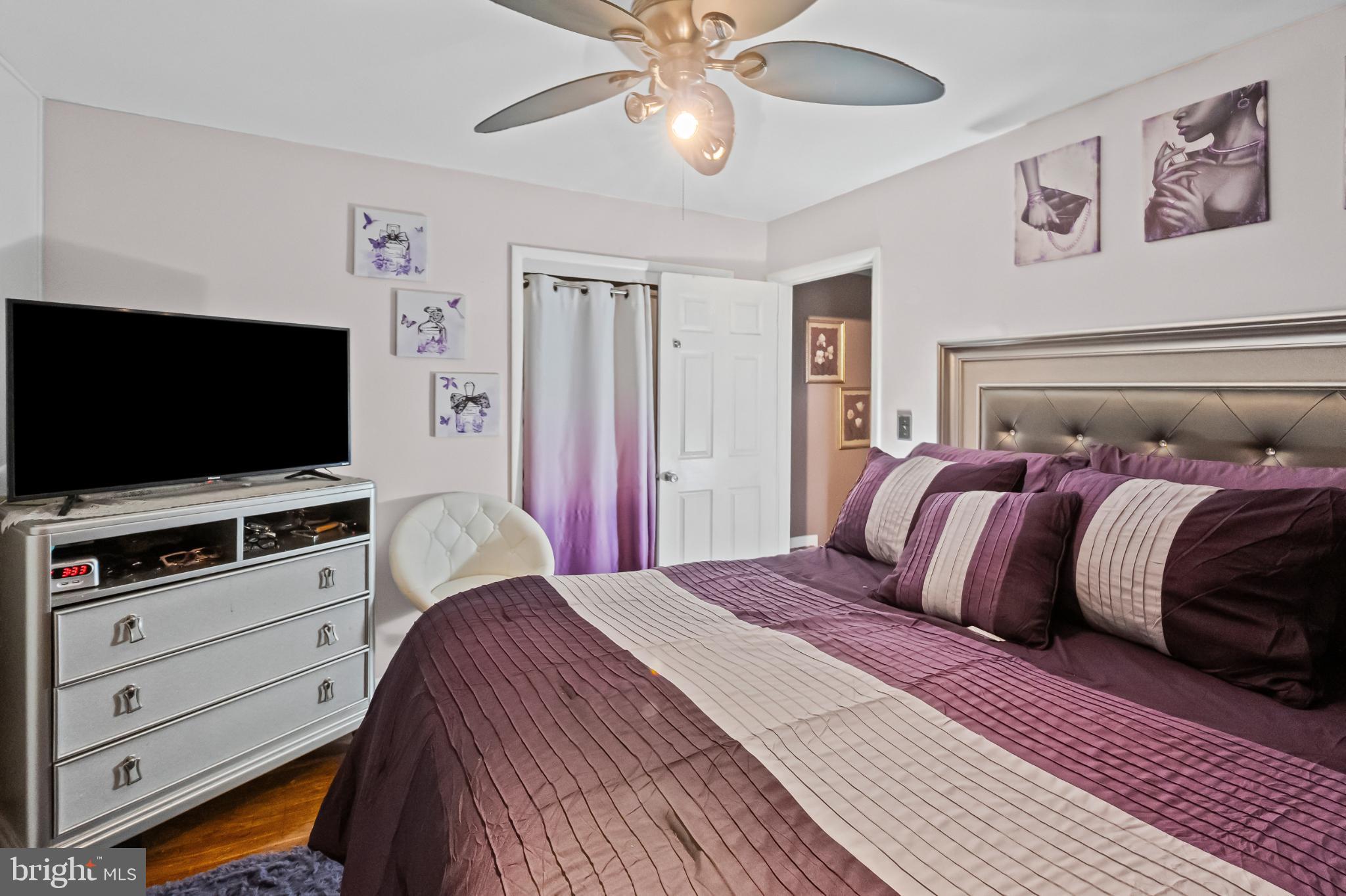 1205 Sheridan Avenue Baltimore, MD 21239 - Photo 16 of 22 Serene bedroom with elegant purple accents.