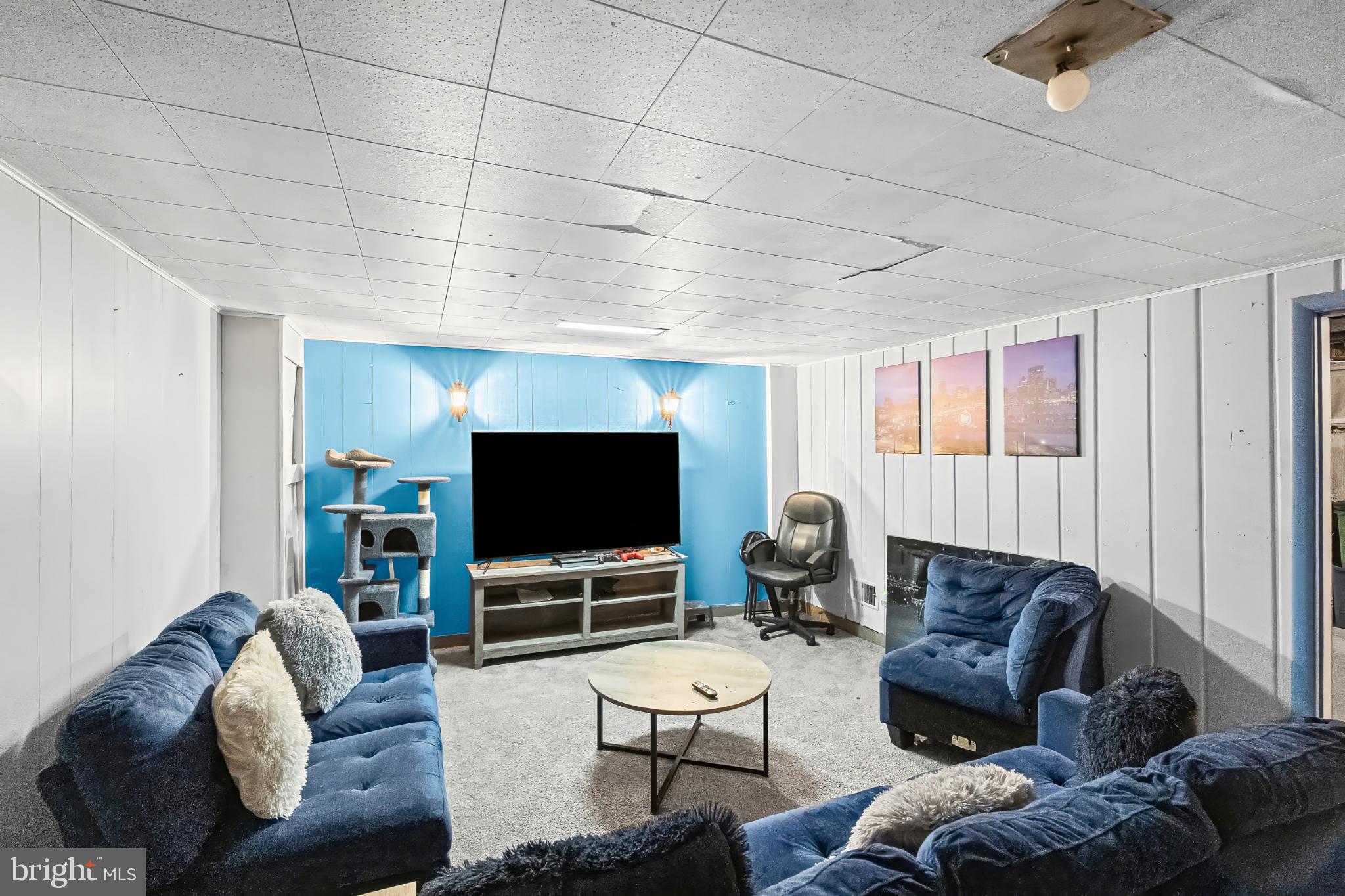 1205 Sheridan Avenue Baltimore, MD 21239 - Photo 20 of 22 Cozy basement retreat with vibrant accents.