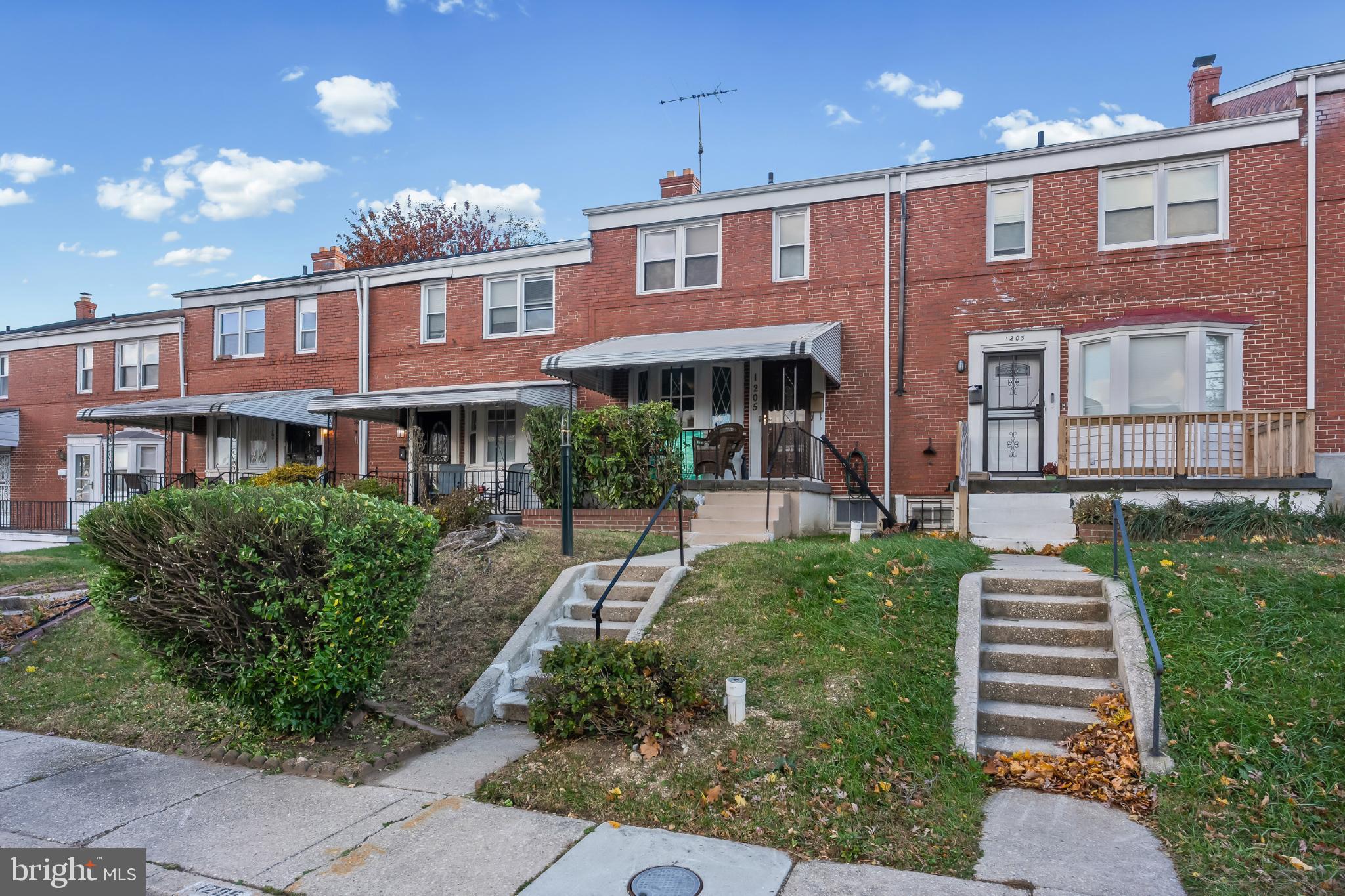 1205 Sheridan Avenue Baltimore, MD 21239 - Photo 2 of 22 Charming brick townhomes with inviting porches.