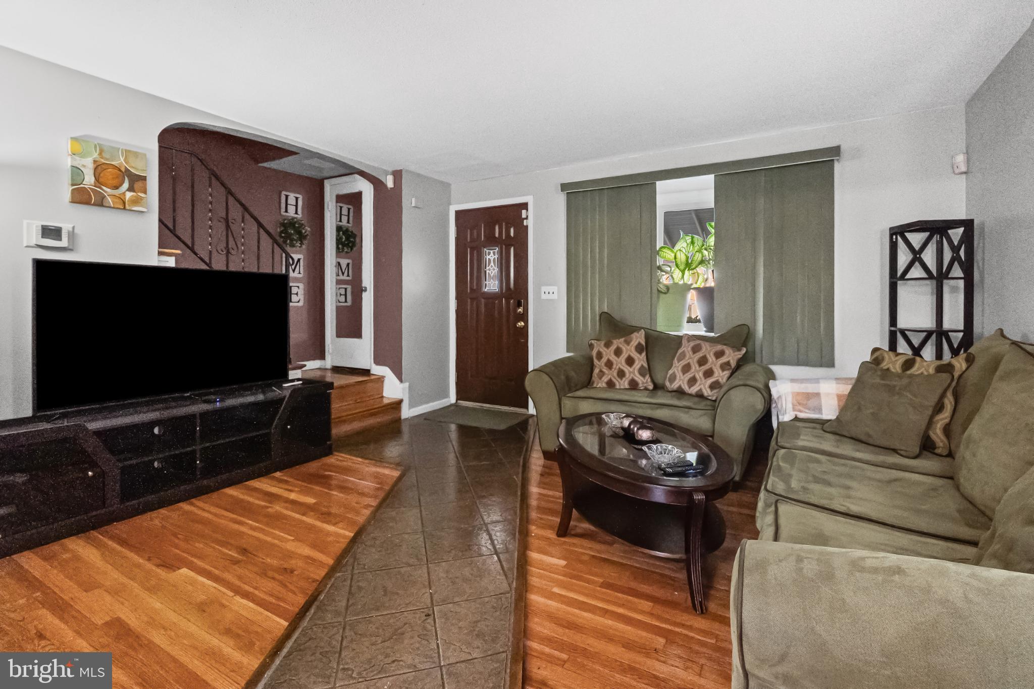 1205 Sheridan Avenue Baltimore, MD 21239 - Photo 5 of 22 Inviting living space with warm wood accents.
