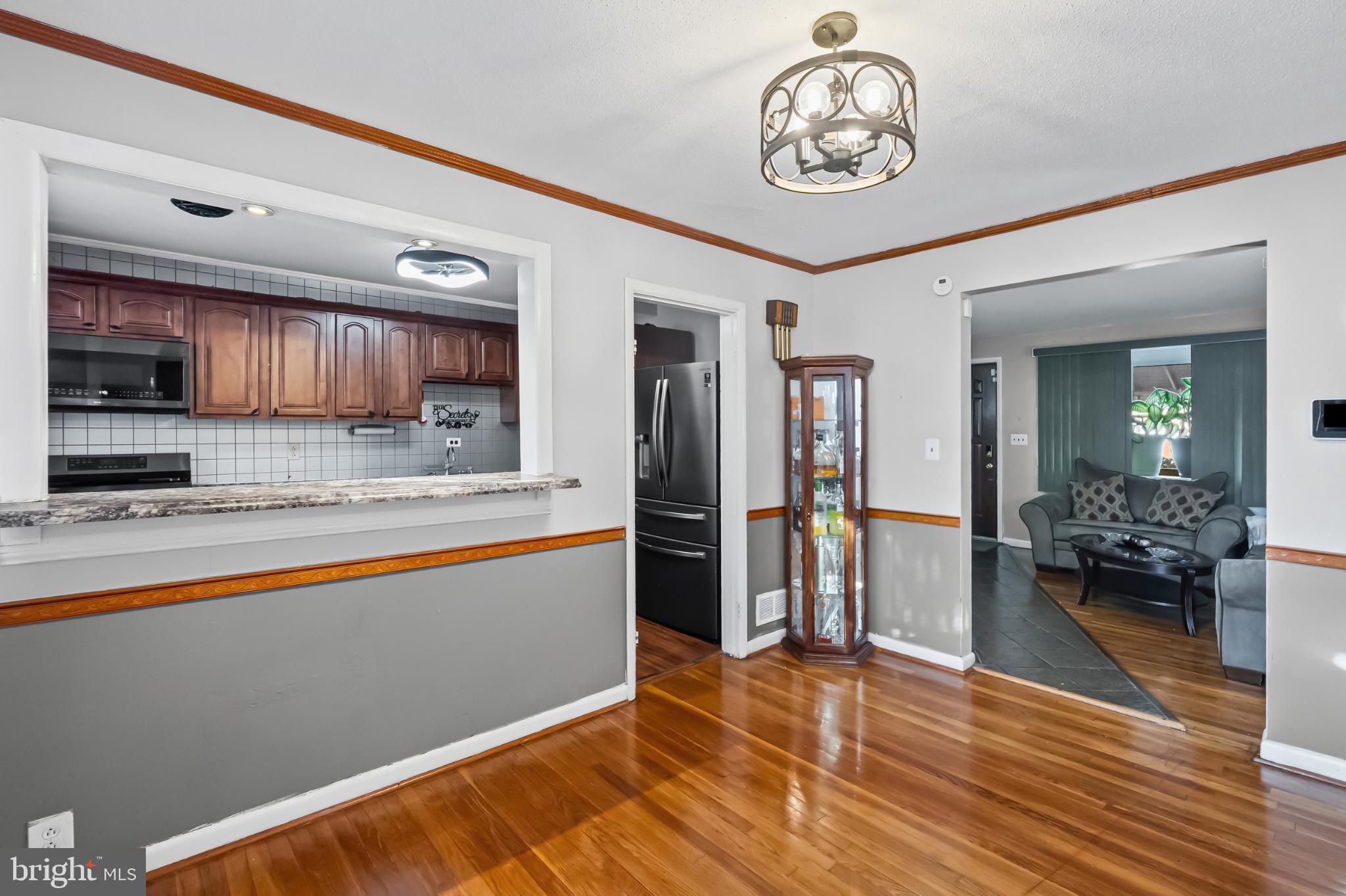 1205 Sheridan Avenue Baltimore, MD 21239 - Photo 7 of 22 Inviting open layout with warm wood accents.