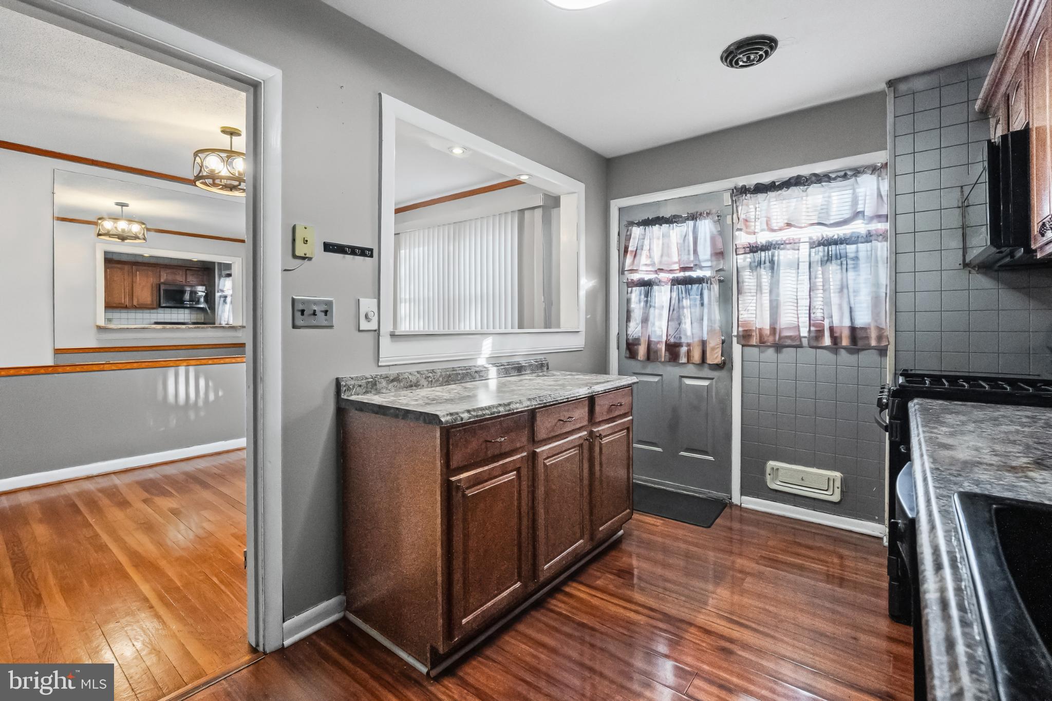 1205 Sheridan Avenue Baltimore, MD 21239 - Photo 8 of 22 Charming kitchen with warm wood accents.