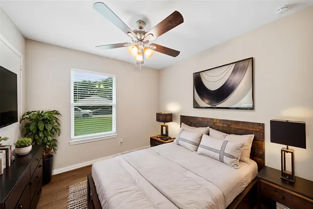 a bedroom with a bed and a window