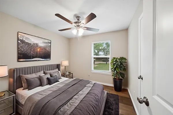 a bedroom with bed and a window