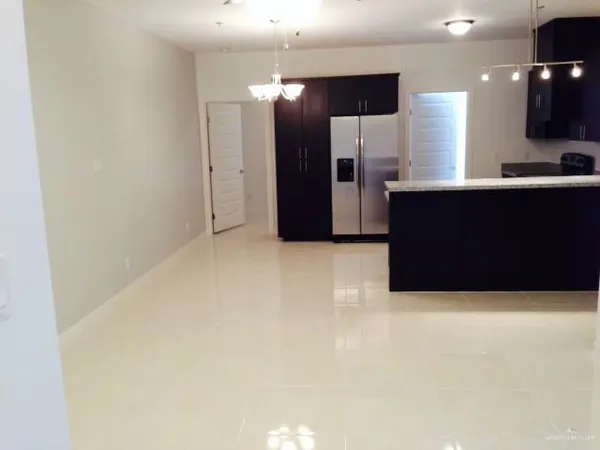 a large bathroom with a large mirror and shower
