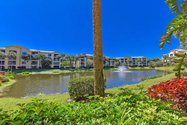 a view of a lake with a building in the background