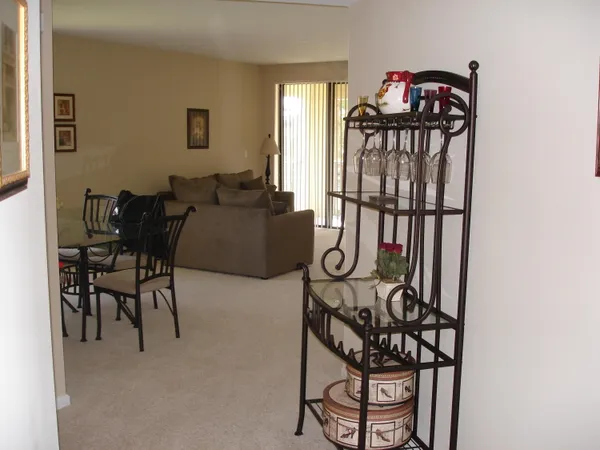 a living room with furniture a fireplace and a window