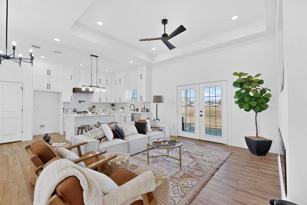 4464 Key Ranch Road Trinidad, TX 75163 - Photo 8 of 40 Living room featuring french doors, ceiling fan, light wood finished floors, a chandelier, and recessed lighting