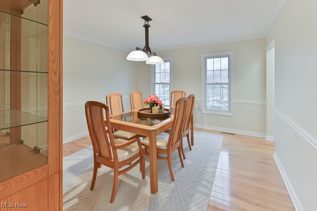 482 Longspur Road Highland Heights, OH 44143 - Photo 18 of 47 Dining area featuring baseboards, crown molding, and light wood finished floors