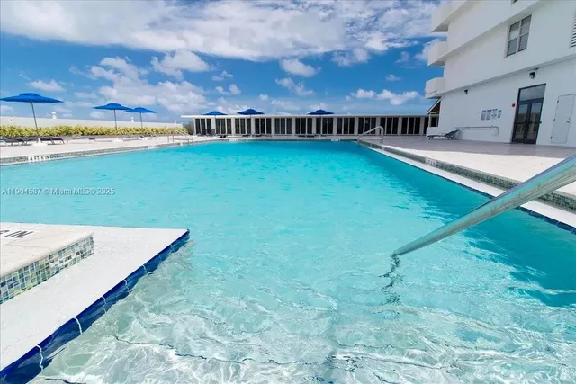 a view of swimming pool from a balcony
