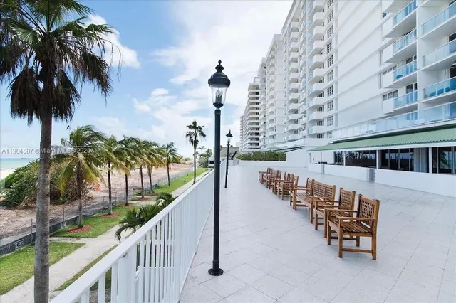 a view of balcony with outdoor seating and wooden floor