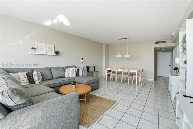 a living room with furniture and a table