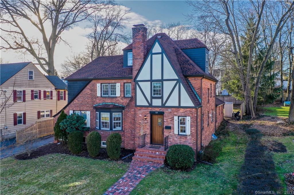 63 Arnoldale Road West Hartford, CT 06119 - Photo 1 of 1 front view of a house with a yard