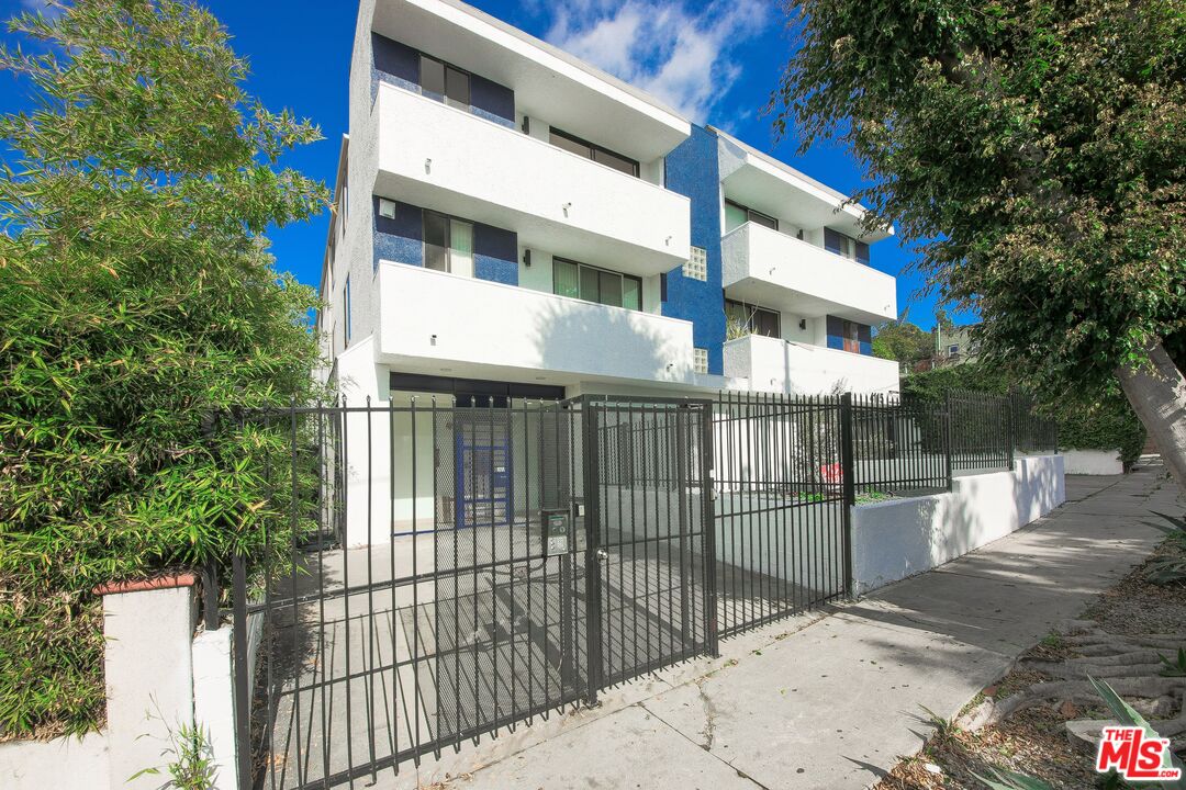 4115 Normal Avenue Los Angeles, CA 90029 - Photo 2 of 7 a view of a brick building from a balcony