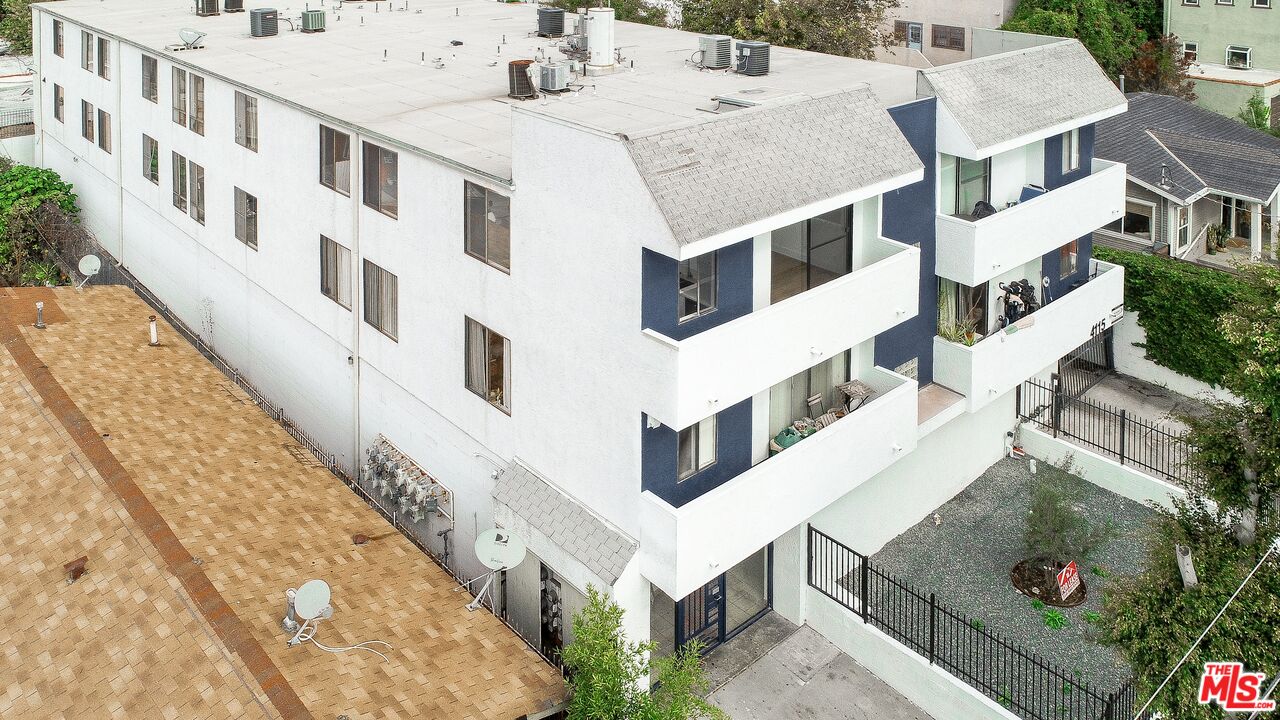 4115 Normal Avenue Los Angeles, CA 90029 - Photo 3 of 7 a view of a white building with many windows