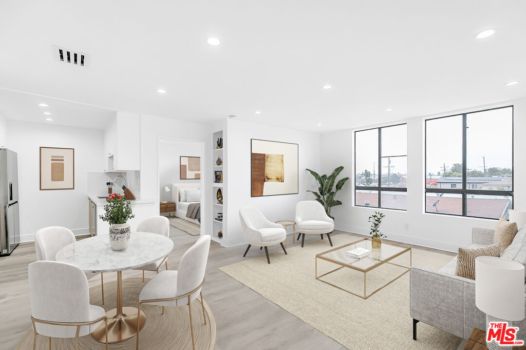 4115 Normal Avenue Los Angeles, CA 90029 - Photo 4 of 7 a living room with furniture and a large window