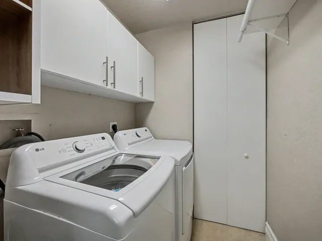 a utility room with dryer and washer