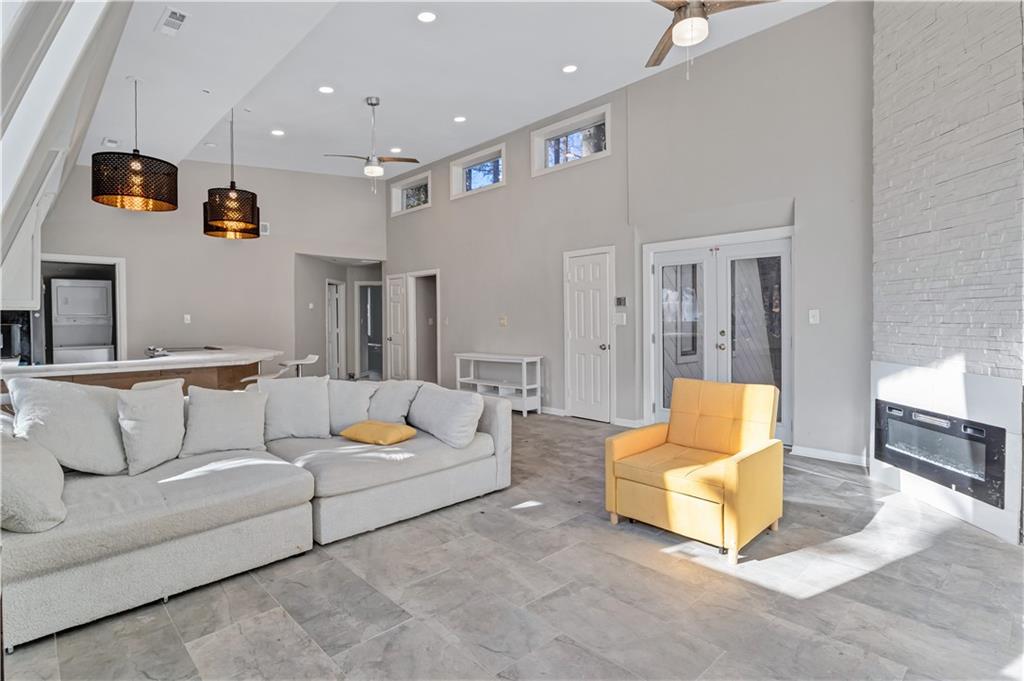 1920 Moores Mill Road Northwest Atlanta, GA 30318 - Photo 2 of 33 a living room with furniture and a flat screen tv